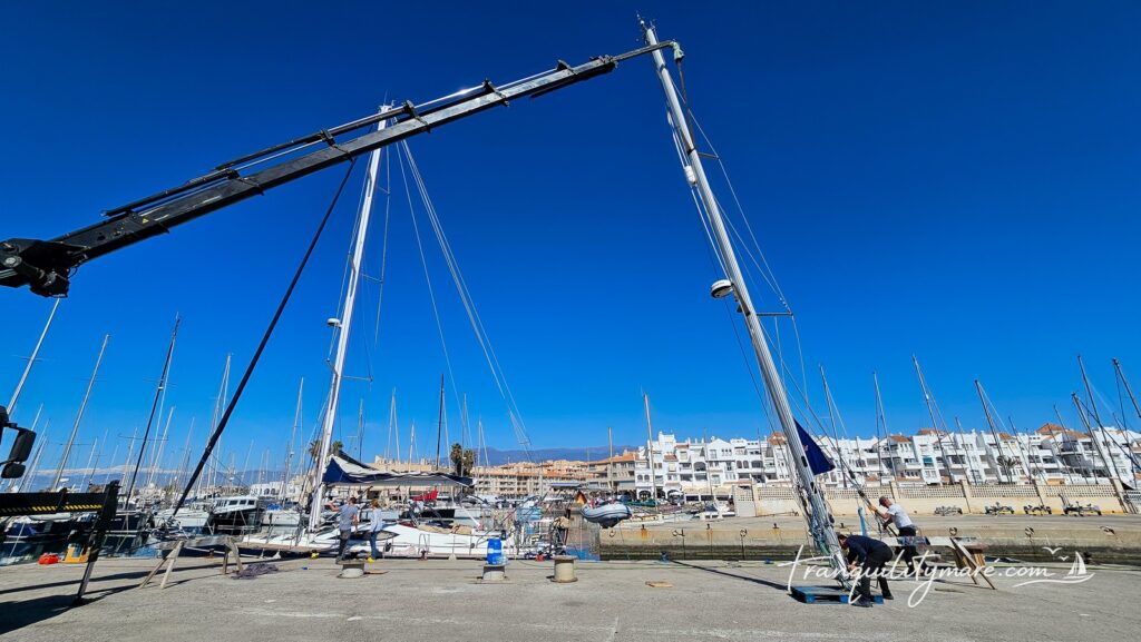 Stepping down the mast of Malo 39 in Almerimar, Spain